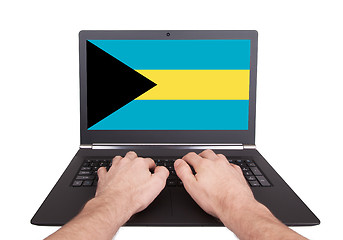 Image showing Hands working on laptop, Bahamas
