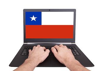 Image showing Hands working on laptop, Chile