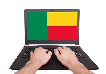 Image showing Hands working on laptop, Benin