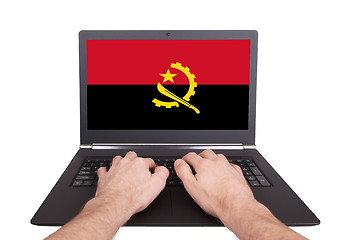 Image showing Hands working on laptop, Angola