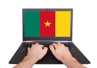 Image showing Hands working on laptop, Cameroon