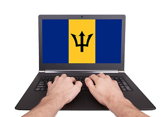 Image showing Hands working on laptop, Barbados