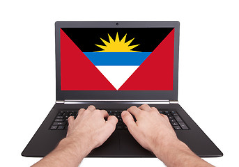 Image showing Hands working on laptop, Antigua and Barbuda