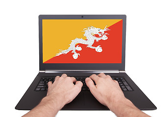 Image showing Hands working on laptop, Bhutan