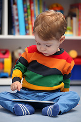 Image showing Happy 2 years old boy using a digital tablet computer