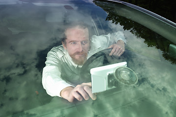 Image showing Driver using  GPS navigation a way