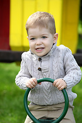Image showing 2 years old Baby boy on playground in spring outdoor park 