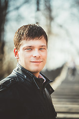 Image showing Handsome man outdoors portrait. Autumn colors.