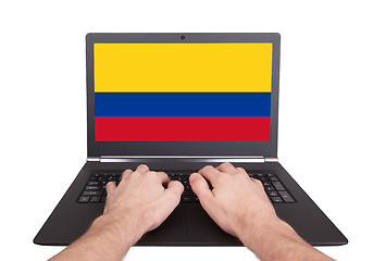 Image showing Hands working on laptop, Colombia