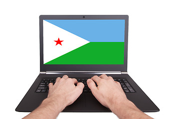 Image showing Hands working on laptop, Djibouti