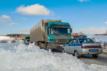 Image showing Trucks stopped on highway after heavy snow storm