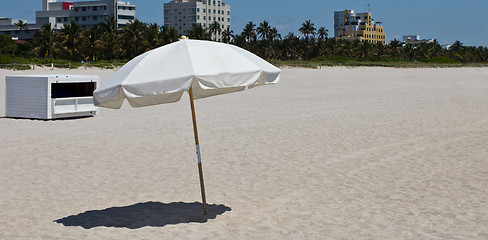 Image showing Sun umbrellas on a sandy beach