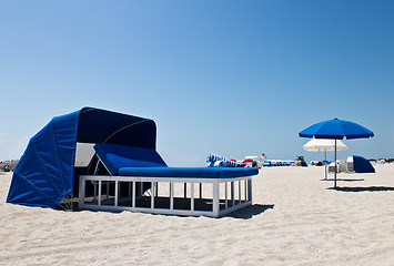Image showing Luxurious beach bed with canopy on a sandy beach