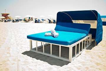 Image showing Luxurious beach bed with canopy on a sandy beach