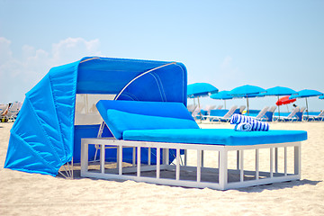 Image showing Luxurious beach bed with canopy on a sandy beach