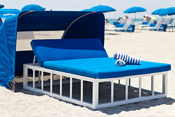 Image showing Luxurious beach bed with canopy on a sandy beach