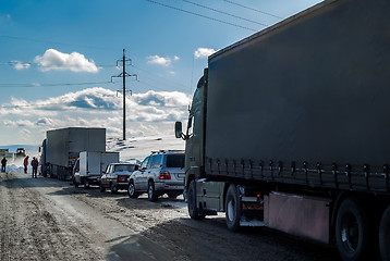 Image showing Trucks stopped on highway after heavy snow storm