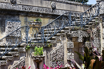 Image showing Old, ornate staircase with flowers