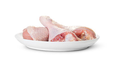 Image showing Three Raw Chicken Legs On White Plate Rotated