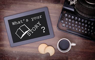 Image showing Tablet touch computer gadget on wooden table, what's your story