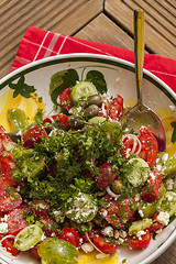 Image showing Bowl of Marinated Greek Salad with Red Napkin