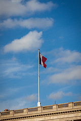 Image showing Flag of France fluttering under a serene blue sky