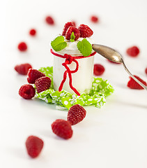 Image showing Raspberries and yoghurt or clotted cream