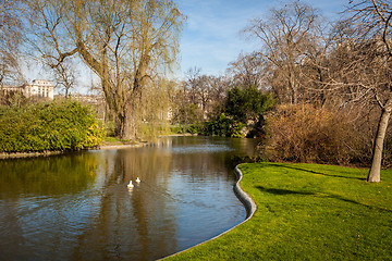 Image showing Tranquil park with a pond and wildflowers