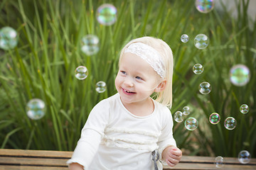 Image showing Adorable Little Girl Having Fun With Bubbles