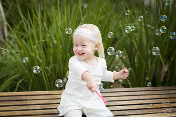 Image showing Adorable Little Girl Having Fun With Bubbles