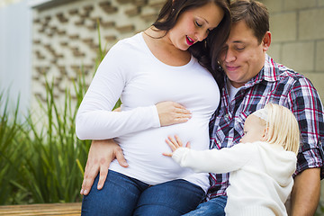 Image showing Adorable Baby Girl with Young Pregnant Parents