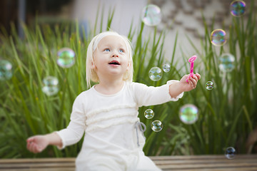 Image showing Adorable Little Girl Having Fun With Bubbles