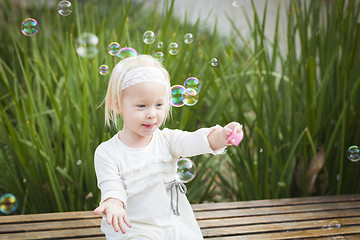 Image showing Adorable Little Girl Having Fun With Bubbles