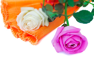 Image showing Bouquet of roses in a beautiful package on a white background.