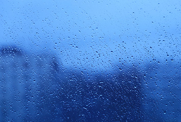 Image showing Natural water drops on glass