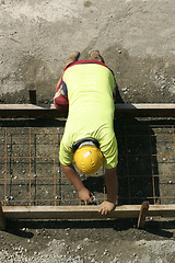 Image showing Worker preparing formwork
