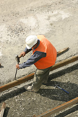 Image showing Hammering into hard ground