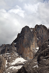 Image showing Rocks with snow and cloudy sky