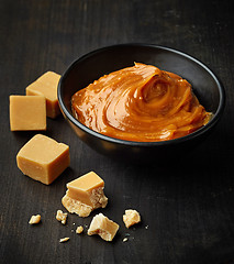 Image showing Bowl of melted caramel cream