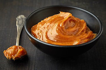 Image showing Bowl of melted caramel cream