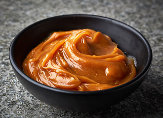 Image showing Bowl of melted caramel cream