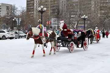 Image showing Festive drivings in the carriage with Father Frost.