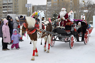 Image showing Festive drivings in the carriage with Father Frost.