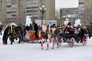 Image showing Festive drivings in the carriage with Father Frost