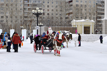 Image showing Festive drivings in the carriage with Father Frost