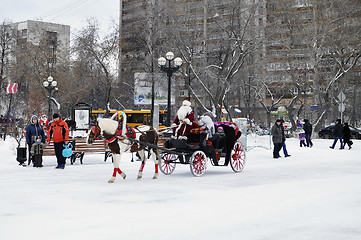 Image showing Festive drivings in the carriage with Father Frost.