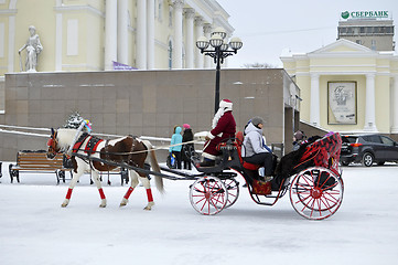 Image showing Festive drivings in the carriage with Father Frost.