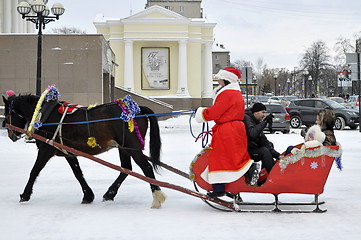 Image showing Festive drivings on sledge with Father Frost.