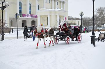 Image showing Festive drivings in the carriage with Father Frost.