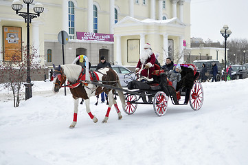 Image showing Festive drivings in the carriage with Father Frost.